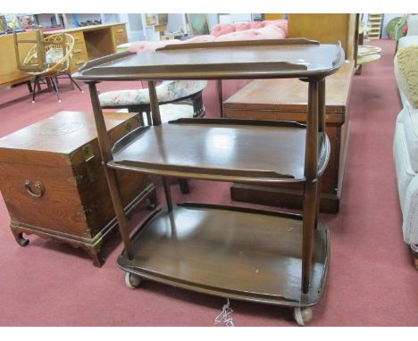 An Ercol Three Tier Dinner Trolley, with galleried sides, on castors.