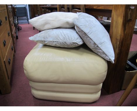 A Cream Leather Pouffe Footstool, together with assorted cream fabric cushions. 