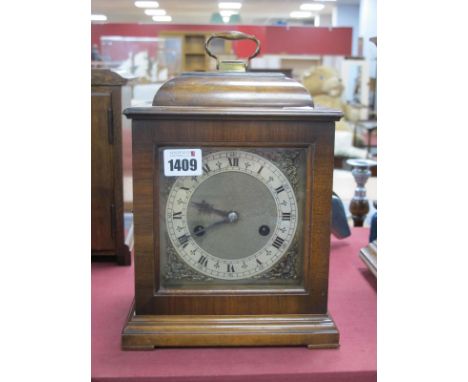 A XX Century Enfield England Walnut Cased Bracket Clock, the dial with Roman numerals, corner spandrels, on a stepped base, 2