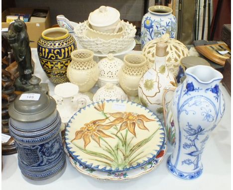 A ceramic baluster vase decorated with a parrot and butterfly, 25cm high and other ceramics and pottery, including Leeds ware