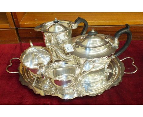 A four-piece silver plated tea service, a Selkirk Glass paperweight and two others.