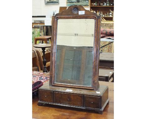 A Queen-Anne-style walnut dressing glass, the rectangular base fitted with three drawers, on bracket feet, 42cm wide, 82.5cm 