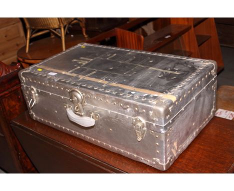 An aluminium travel trunk, a framed set of cigarette cards of famous cricketers and another print of a cricket match
