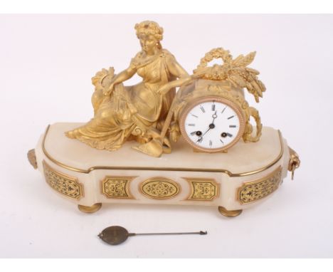 A French late 19th Century mantel clock in gilt metal case with figure of Ceres, white alabaster base decorated gilt metal pa