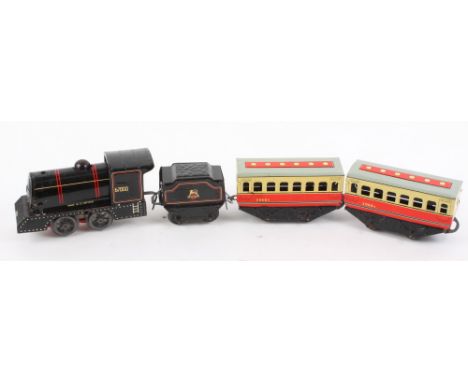 A British made clockwork train and tender, rolling stock, and two boxed Corgi Classics, 1915 Ford and 1910 Renault