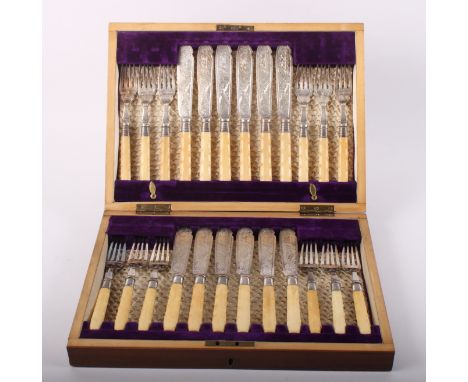 A selection of silver plated Old English and other flatware, in oak canteen