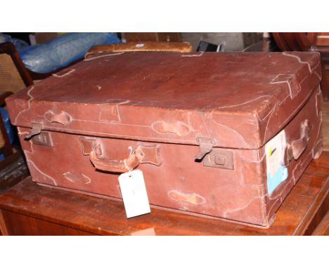 A brown leather travelling trunk