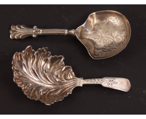 A Georgian silver caddy spoon with leaf-shaped bowl and bright cut engraved handle and a Victorian silver caddy spoon with br