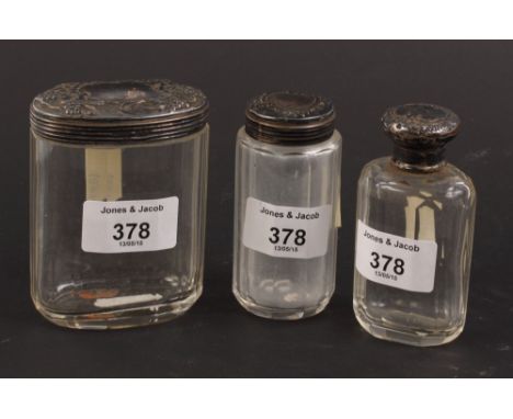 Three cut glass and silver mounted dressing table jars
