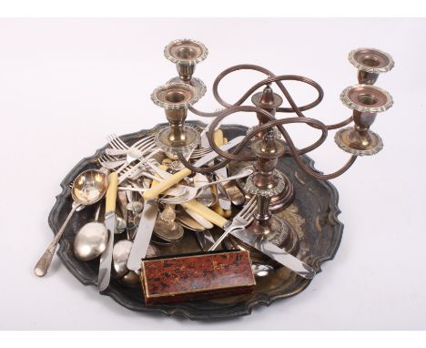 A pair of silver plated three-branch candelabra, a plated tray and a large amount of plated flatware