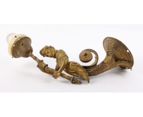 A Victorian gilt metal wall light with figure supporter and flammiform shade (glass shade damaged)