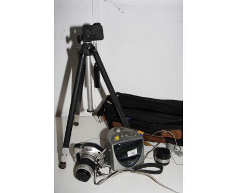 A Nikon Pronea S camera with two zoom lenses, a camera tripod and a Roberts radio