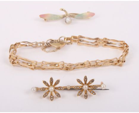 A 9ct gold gate link bracelet, 3.4g, a 15ct gold enamel and pearl floral spray brooch and a gilt metal and seed pearl floral 