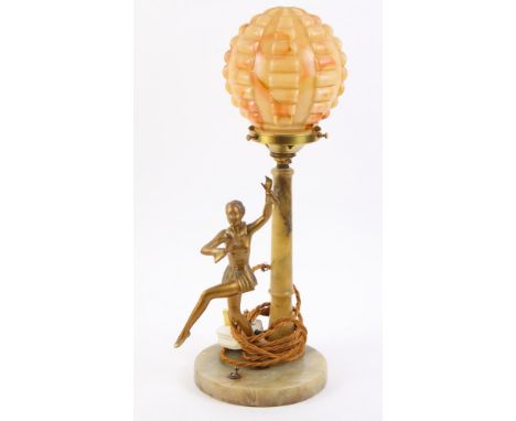 An Art Deco onyx electric table lamp with spherical marbled glass shade, on circular base with gilt metal figure of a dancing