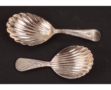 A Georgian silver caddy spoon with shell-shaped bowl and bright cut engraved handle and a similar later caddy spoon