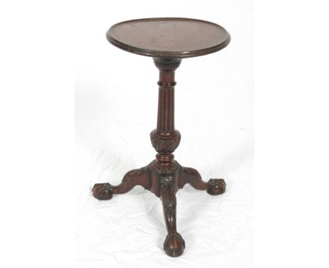 A 19th Century mahogany kettle stand of early Georgian design, on acanthus carved tripod splay supports and claw and ball fee