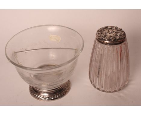 An ovoid ribbed glass sugar sifter bottle with sterling silver top and an engraved glass bowl with division on plated base