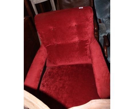 A Victorian open easy armchair, button upholstered in a red velour