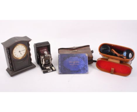 A pair of L & G Telstar 20 x 52 binoculars, in case, and an oak cased mantel clock with twist turned pilasters