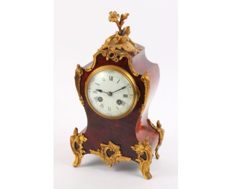 A Louis XV design mantel clock in red stained tortoiseshell case with gilt metal mounts, movement stamped Maple & Co Paris, 1
