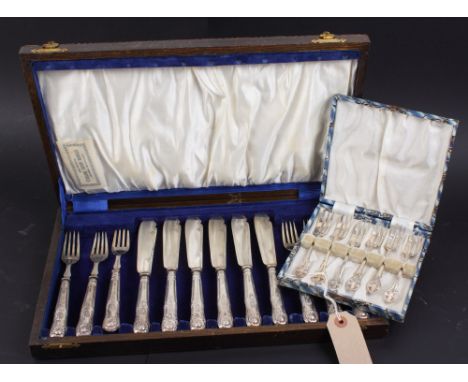A canteen of six pairs of King's Pattern fish knives and forks, a cased set of cake forks and a silver ring set brilliants