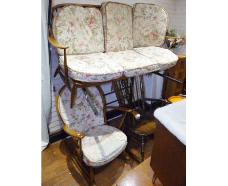 ERCOL SETTEE AND ROCKING CHAIR. Ercol three seater upholstered settee and an upholstered Ercol rocking chair