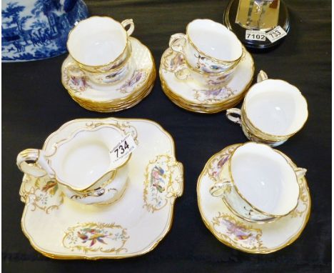 MINTON TEA SERVICE. Minton part tea service in bird design on white ground