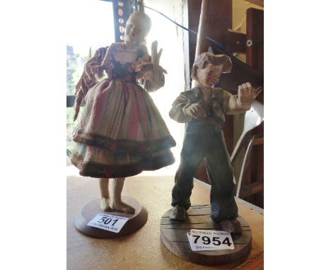 WOODEN FIGURE AND DOLL. Carved wooden figure and a ceramic headed doll, H ~ 24cm