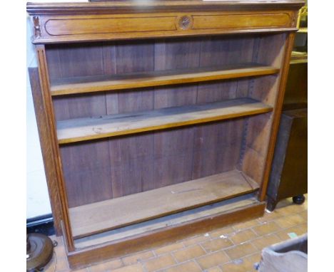 OAK BOOKCASE. Light oak bookcase with glazed doors and carved detail to top, 134 x 138cm