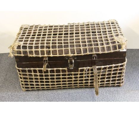 Antique Eastern hardwood cabin trunk with leather strapping and original woven bamboo carrying case containing some French do