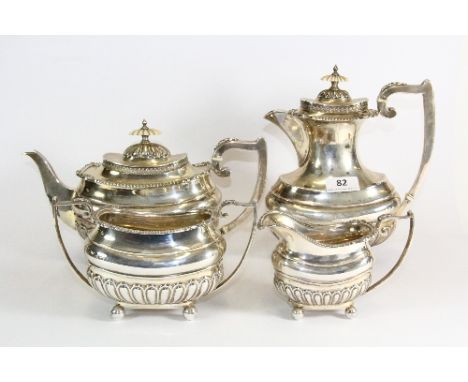 A heavy hallmarked silver four piece tea set with ivory handles, Walker and Hall. Approx 2140g