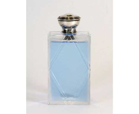 An early 20thC silver topped cut glass cologne bottle. H.13.5cm