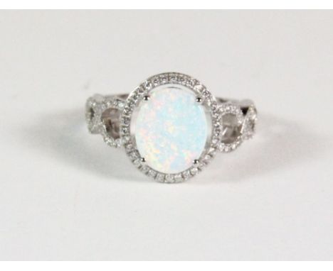 A .925 silver and faux opal dress ring. Size S