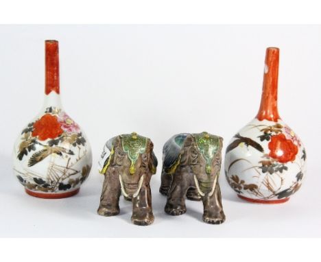A pair of glazed ceramic elephants (8.5cm) and a pair of Japanese porcelain vases (16cm)