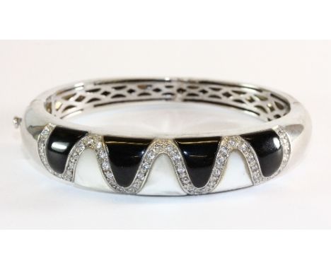 A .925 sliver mother of pearl and onyx bangle (rhodium plated)