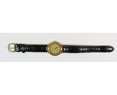 A gents 18ct gold plated Louis Erard wrist watch with diamond and ruby set dial.