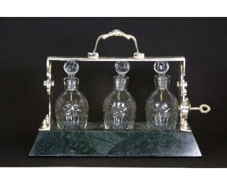 Silver plate and green marble 3 bottle Tantalus (26cm x 18cm)