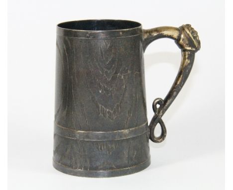 An unusual silver plated tankard