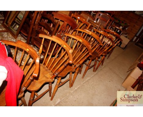 A set of six antique elm seated stick back kitchen chairs