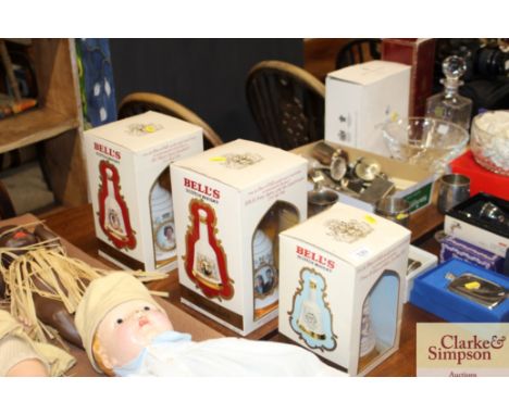 Three boxes Bells Scotch whisky decanters 