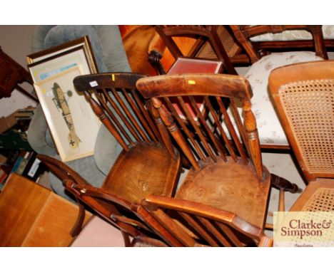 Two late 19th Century elm seated stick back kitchen chairs