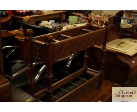 A late Victorian carved oak stick stand 