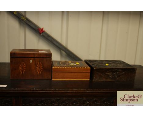 A 19th Century inlaid tea caddy; a carved wooden box; and a trinket box with printed decoration