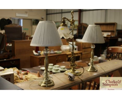 A brass table lamp with glass shade; and a pair of table lamps 