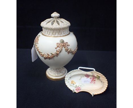 A ROYAL WORCESTER BLUSH IVORY POT-POURRI VASE AND PIERCED COVER decorated with fruit swags in relief 20cm high (inner lid mis