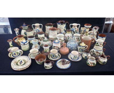 A COLLECTION OF DEVON/TORQUAY POTTERY; ALLER VALE, WATCOMBE etc, slip decorated, some motto ware, many different shapes and s