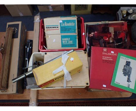 A DURST M302 PHOTOGRAPHIC ENLARGER boxed with instructions, together with a Silk 88 tripod, boxed, two other tripods, a proje