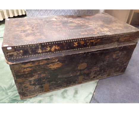 A 19TH CENTURY LEATHER COVERED AND STUDDED TRUNK with brass plaque; 'Capt D. R. Newale', 114 x 57cm, 53cm high