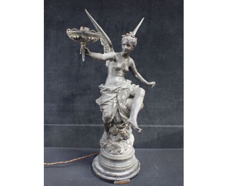 A BELLE EPOQUE SPELTER FIGURAL LAMP 'REVEIL Du PRINTEMPS', after Bouret, a winged female holding a lamp (no shade), on circul