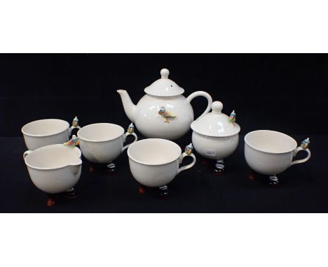 A ‘CARLTONWARE’ NOVELTY POTTERY TEA SERVICE modelled with feet and peg legs, comprising four cups, teapot, milk jug and sugar